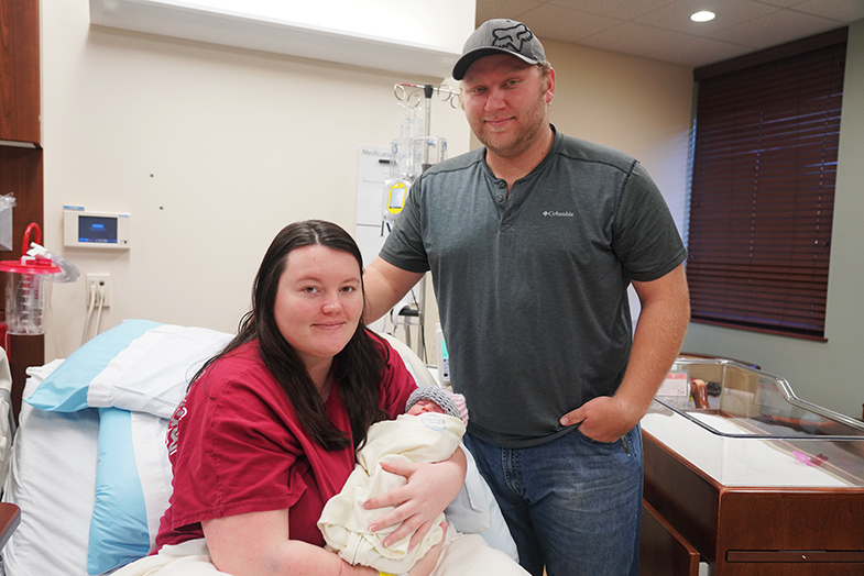 parents holding their newborn